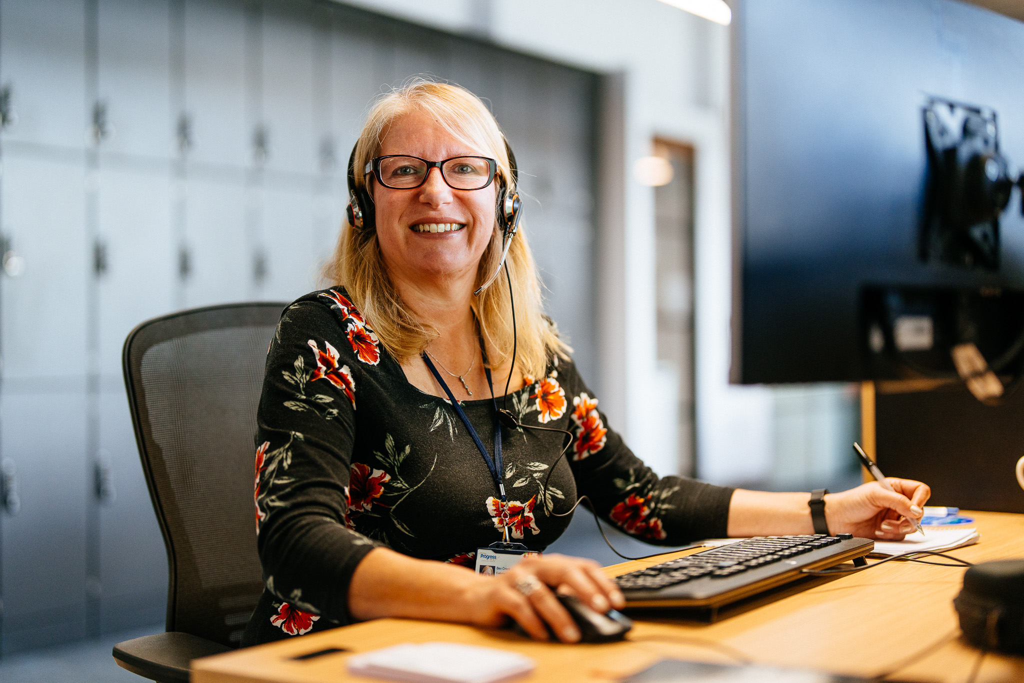 Team member wearing a headset, ready to assist customers.