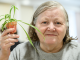 Image of lady showing off her decorated plant pot