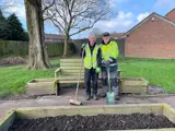 Image of 2 men gardening