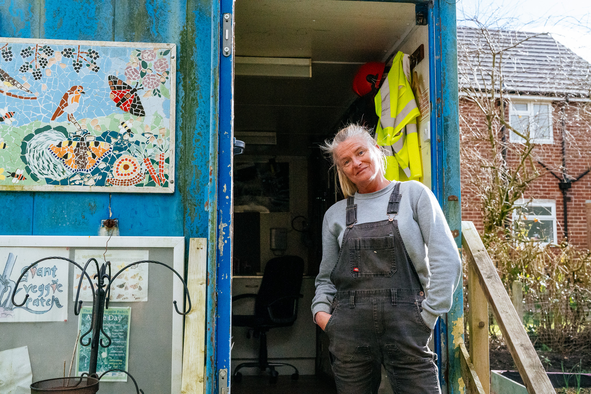 Tina standing in front of the shed in The Base community allotment in Leyland