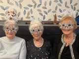 Image of 3 ladies in Christmas themed glasses