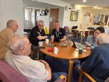 Image of people sat around a table