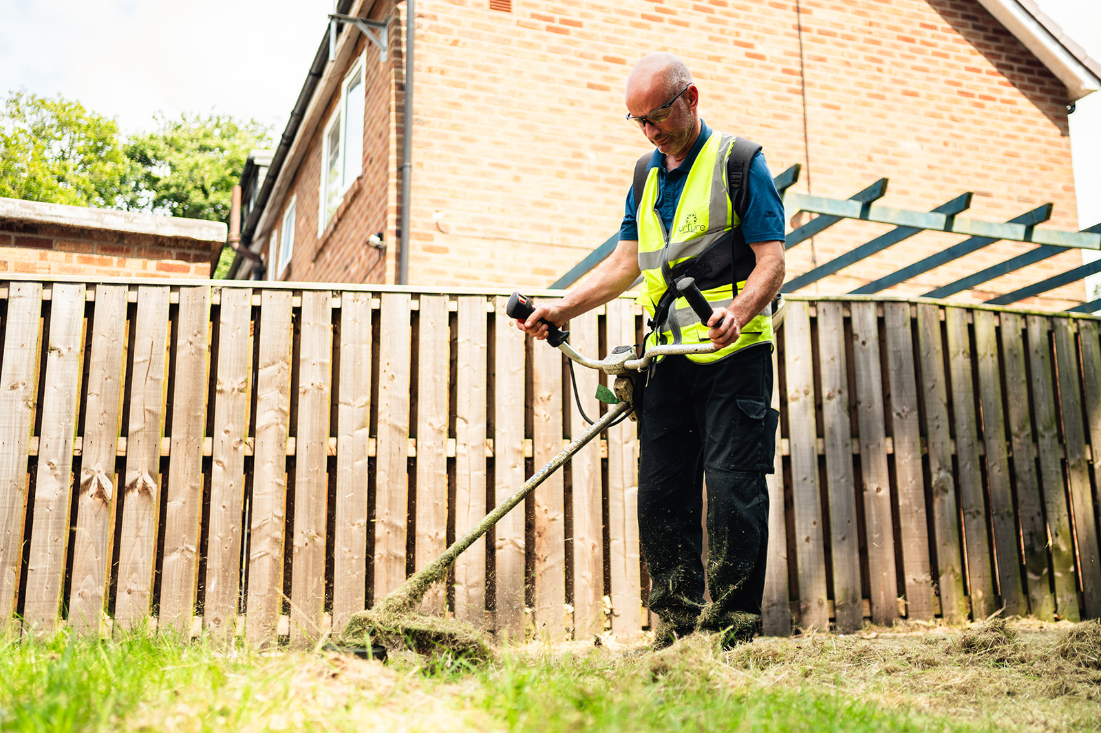 operative strimming a communal area