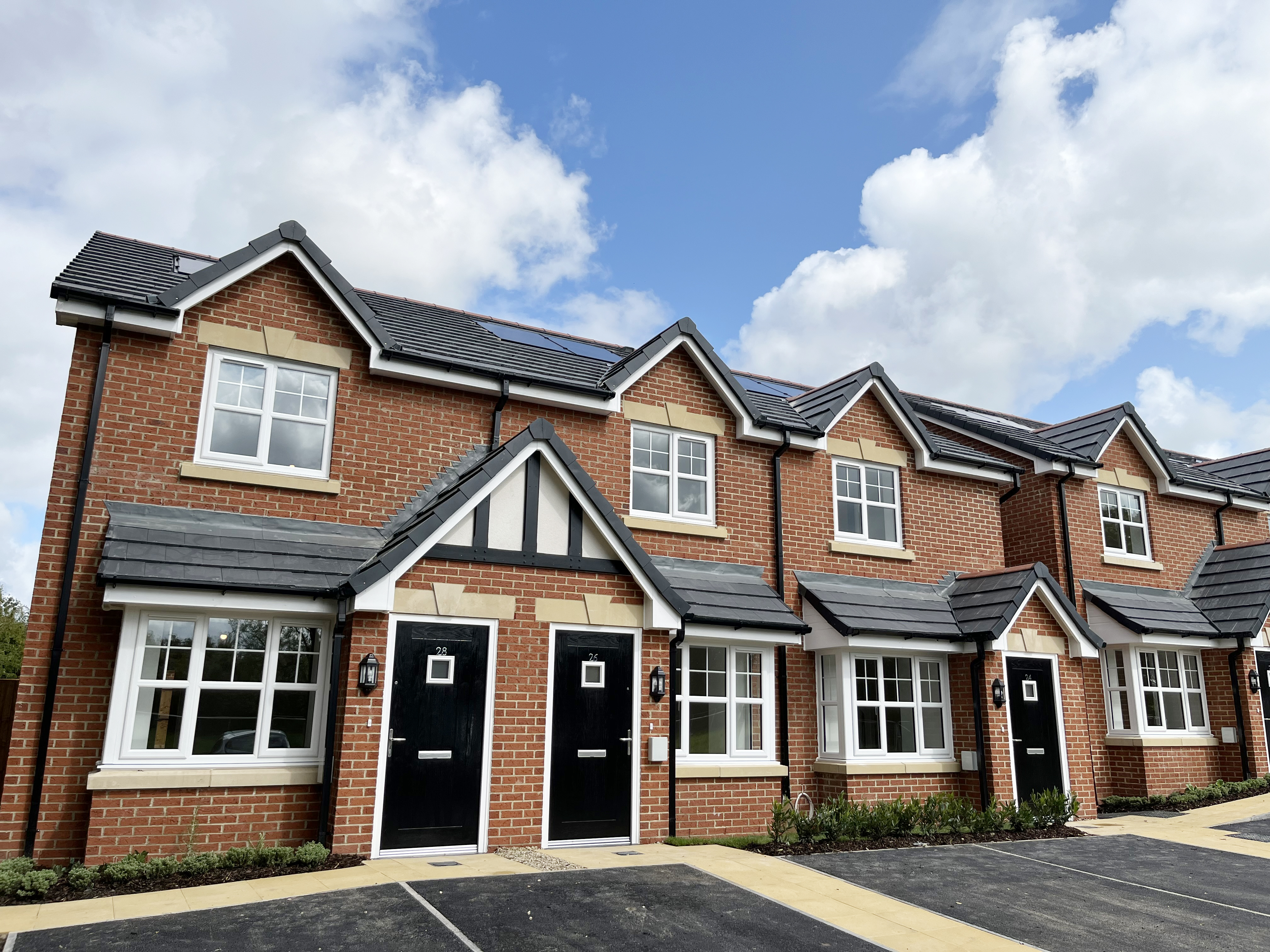 Row of houses in Euxton under a cloudy sky